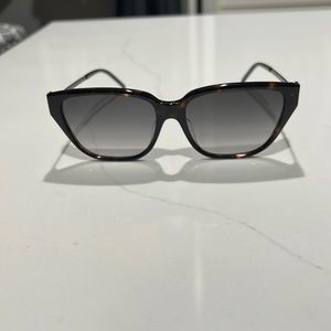 YSL women sunglasses, slightly cat eye, excellent/like new, pretty logo on side.